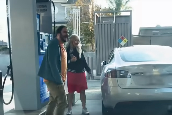 Blonde Woman Trying To Fill Up Petrol In Electronic Tesla Car