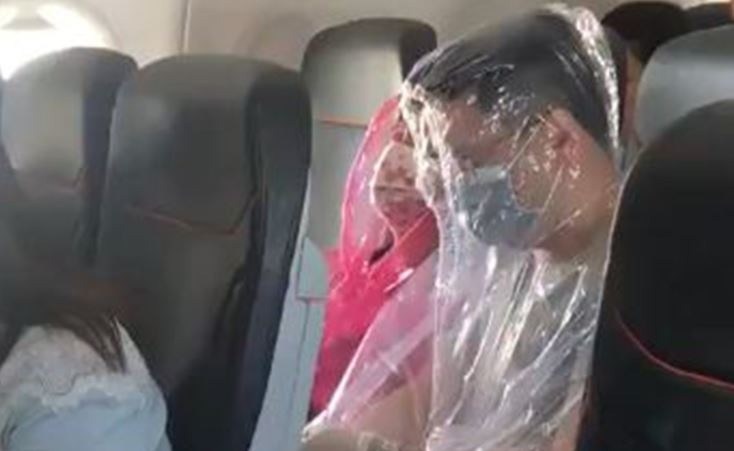 Viral-Video-Passengers-wrap-themselves-in-plastic-on-flight