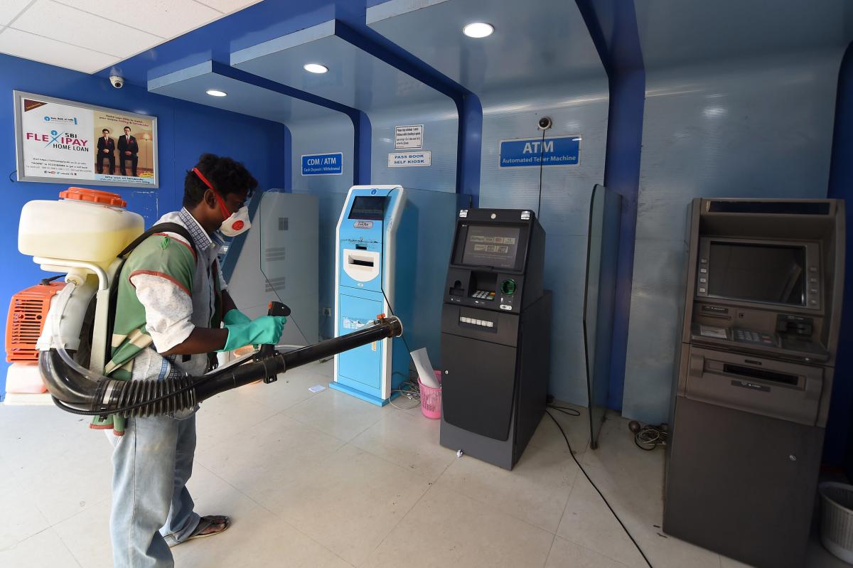 spraying disinfectants on ATM